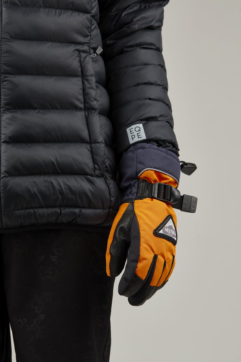 Orange children’s glove with black goat leather palm and wrist adjustment (6 of 8)