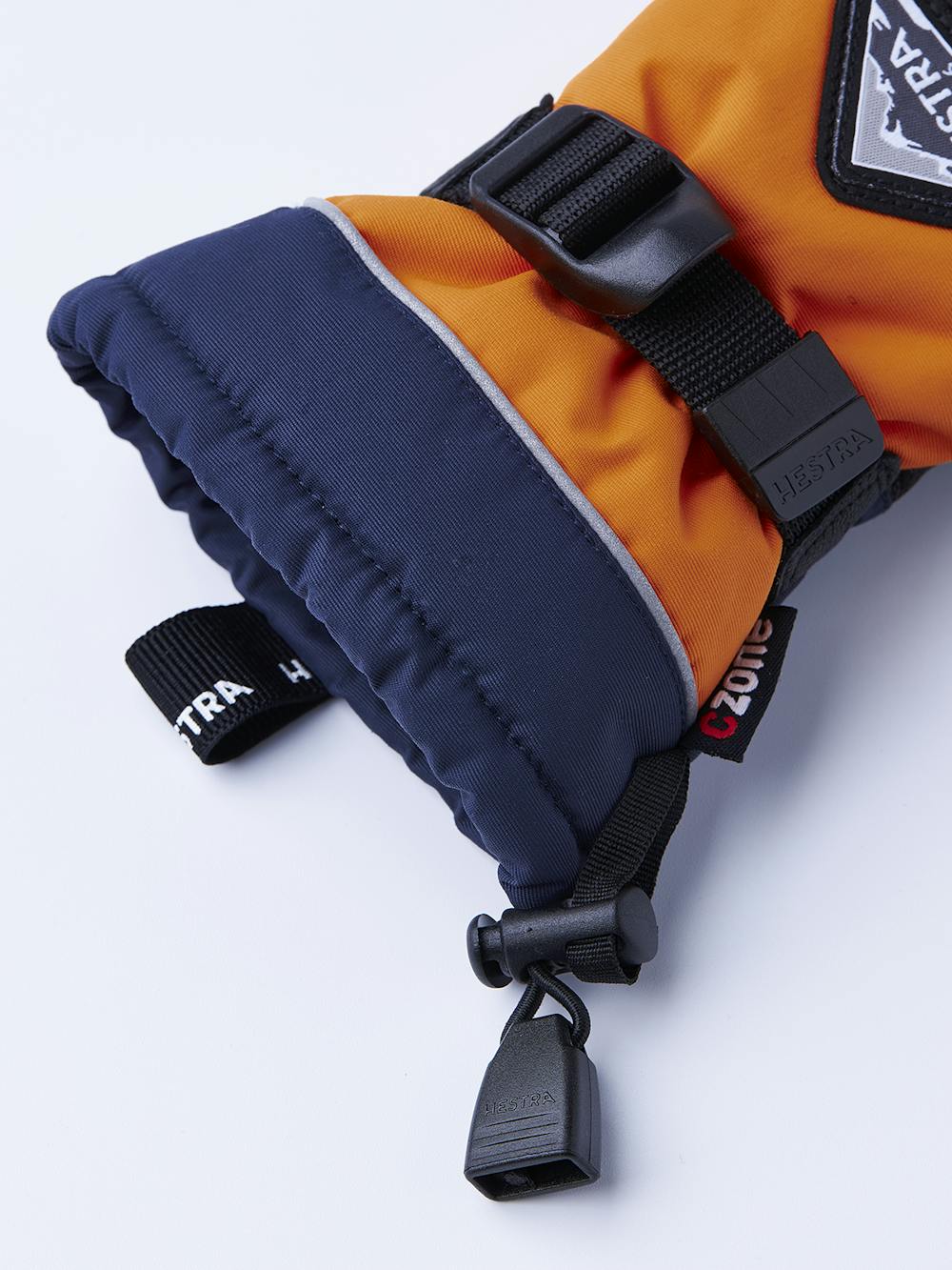 Orange tumhandske med svart getskinn i innerhanden och handledsjustering 
 (3 av 6)