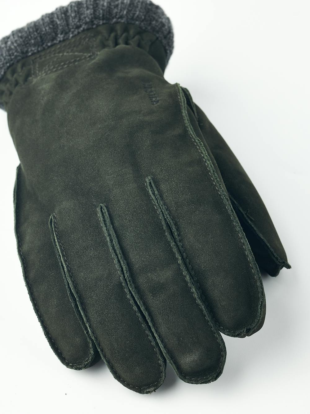 Dark green machine-sewn goat suede glove with gray knitted cuff
 (2 of 5)