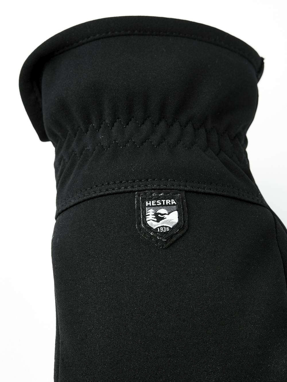 Black machine-sewn fabric glove with elasticated wrist
(4 of 5)