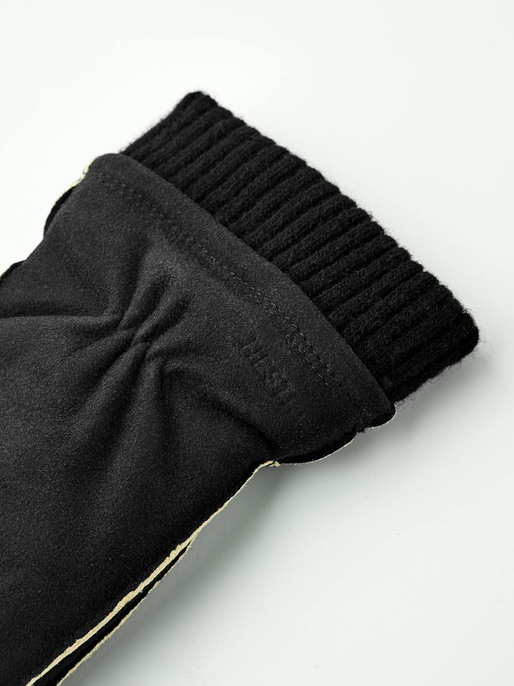 Black machine-sewn suede mitten with knitted cuff
(6 of 6)