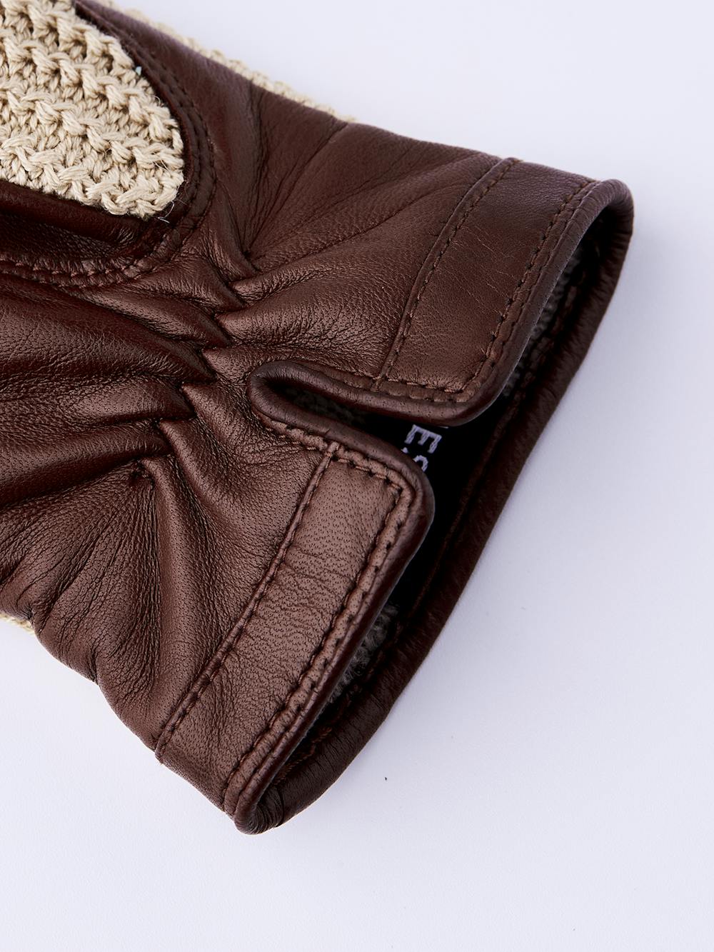 Brown machine-sewn leather glove with beige crocheted cotton back
 (2 of 2)