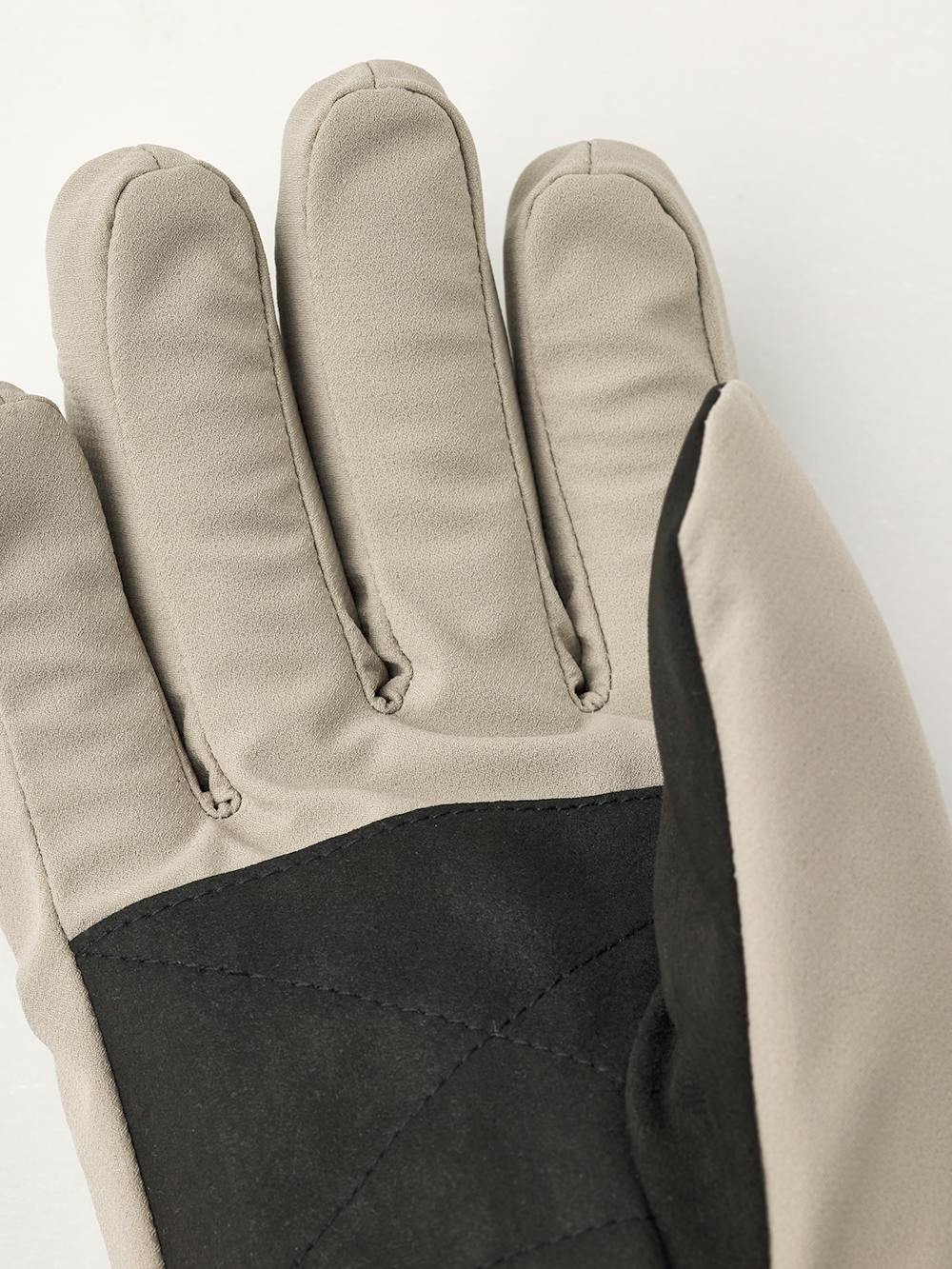 Beige fabric glove with elasticated fabric cuff and black palm
 (3 of 4)