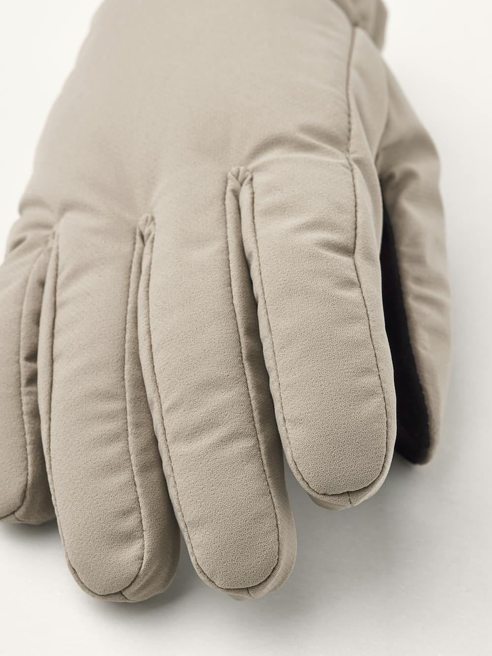 Beige fabric glove with elasticated fabric cuff and black palm
 (4 of 4)