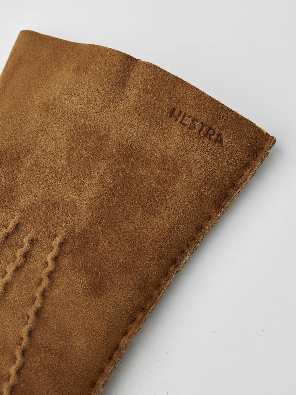 Light brownish-yellow hand-sewn fur suede glove
(3 of 5)