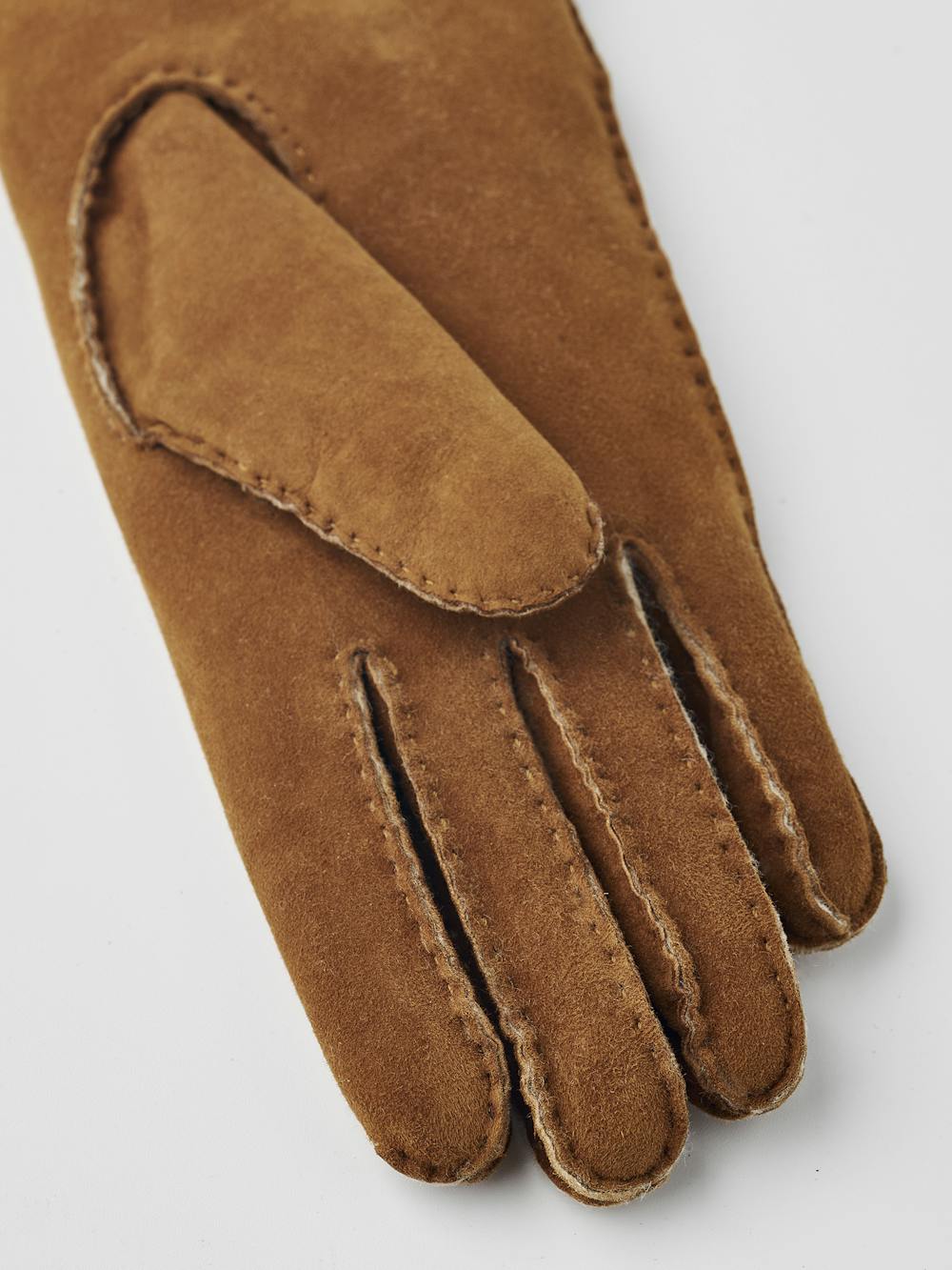 Light brownish-yellow hand-sewn fur suede glove
 (2 of 5)