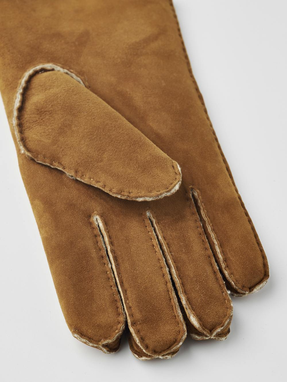 Light brownish-yellow hand-sewn fur suede glove
(3 of 9)