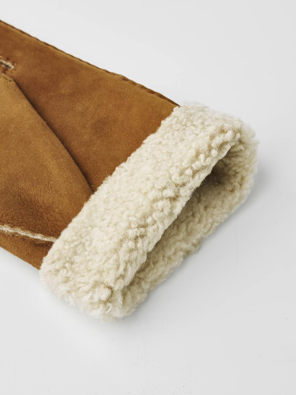 Light brownish-yellow hand-sewn fur suede glove
(4 of 9)