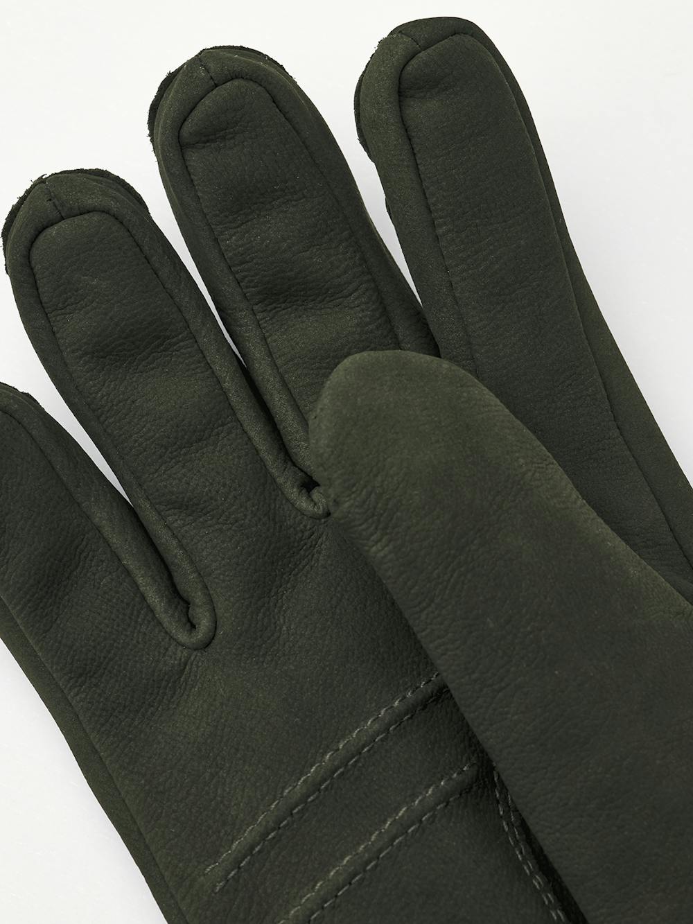 Dark green machine-sewn goat nubuck glove with leather strap and button
 (2 of 4)