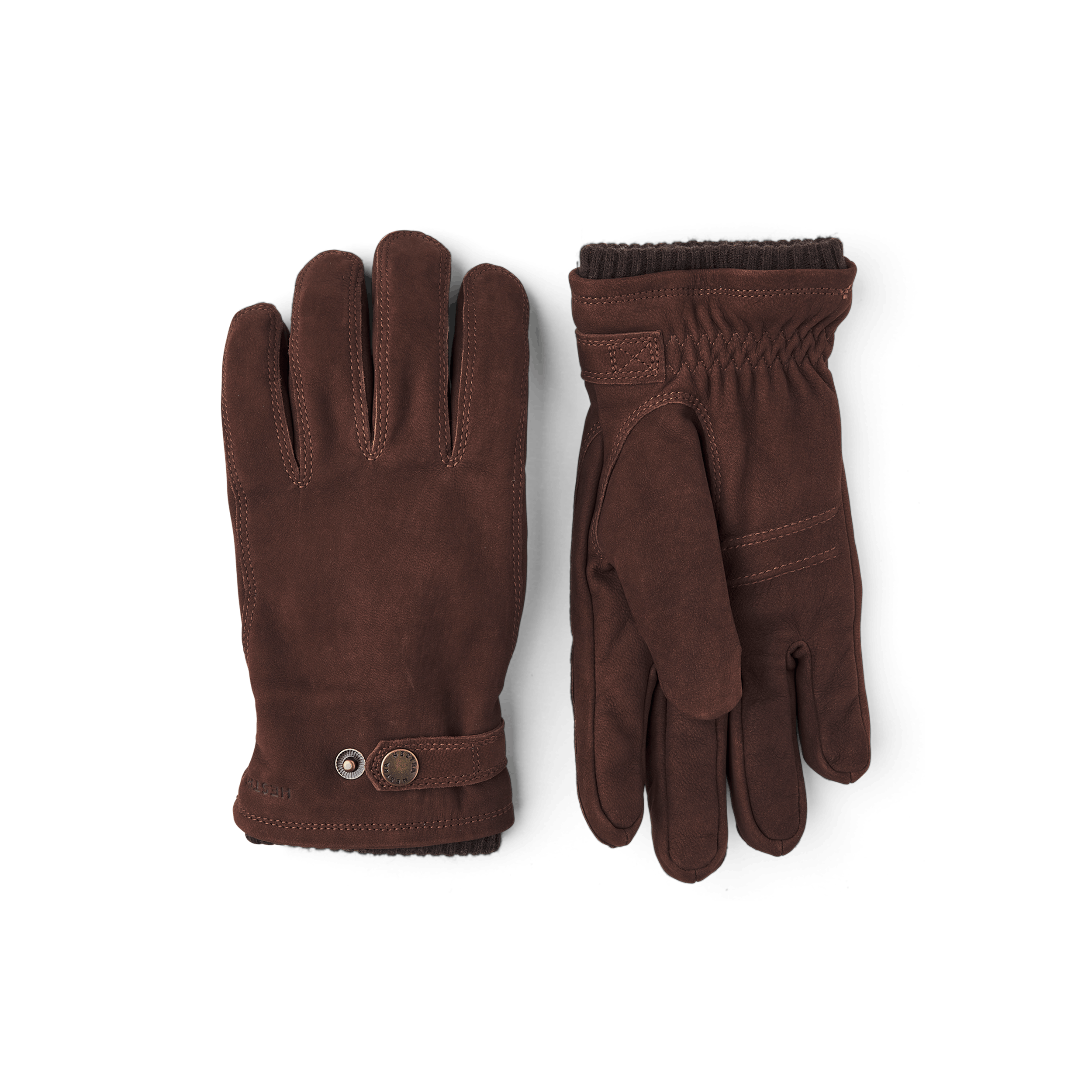 Mörkbrun maskinsydd handske i getnubuck med läderrem och knapp
(1 av 7)