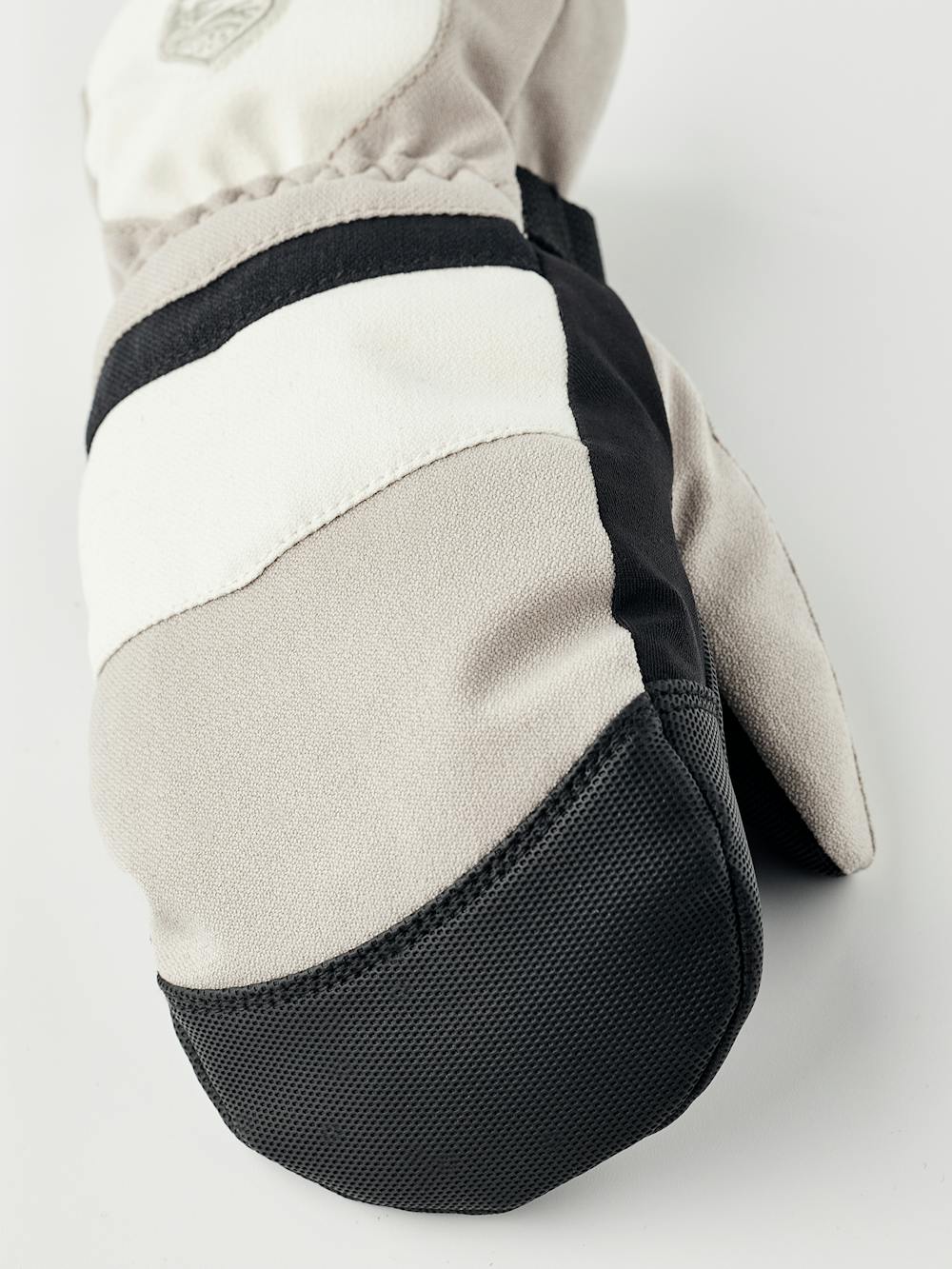 Beige and white fabric mitten with black synthetic palm and wrist adjustment (2 of 5)