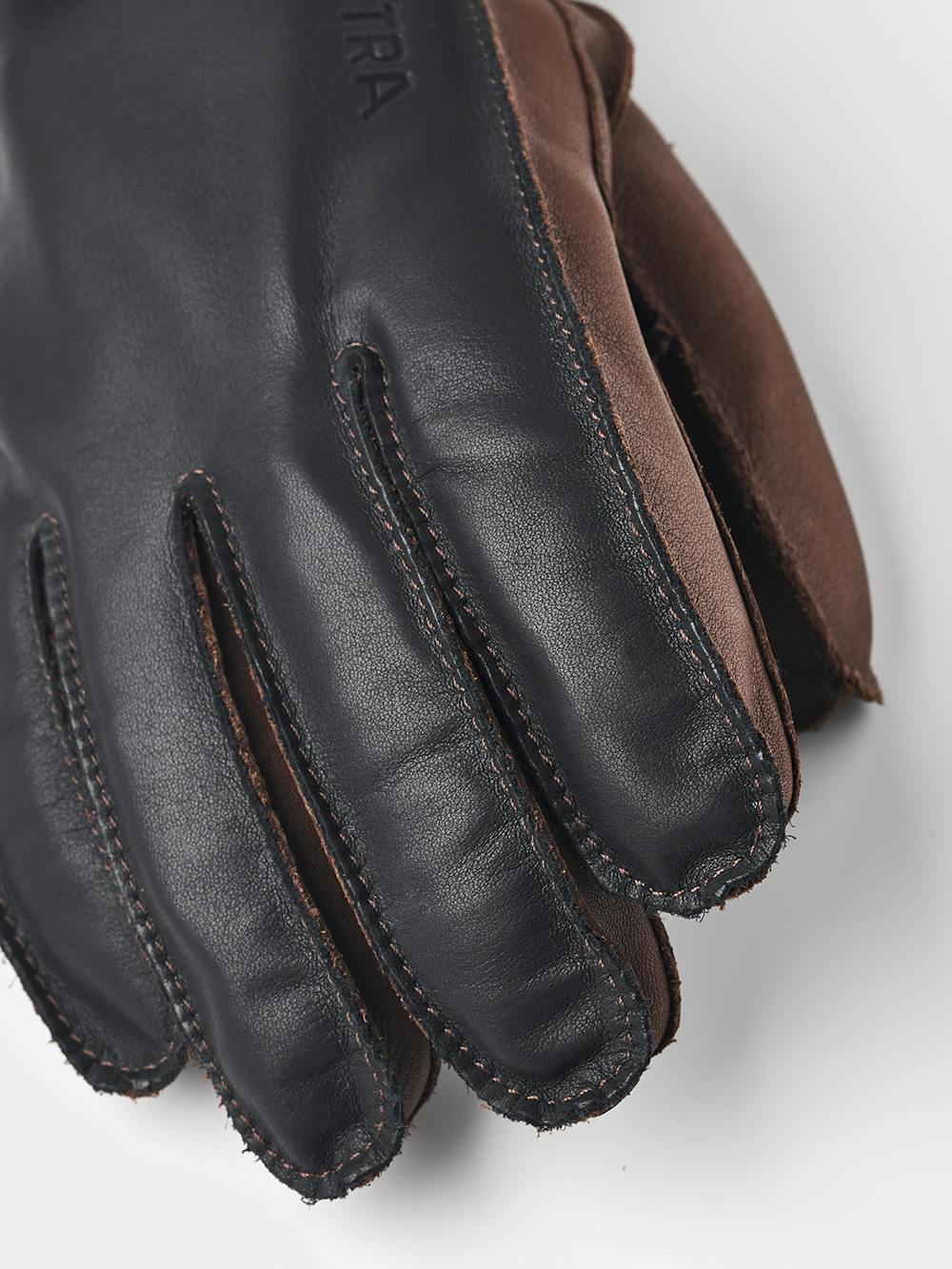 Dark blue cow hide ski glove with dark brown palm and wrist adjustment (2 of 5)