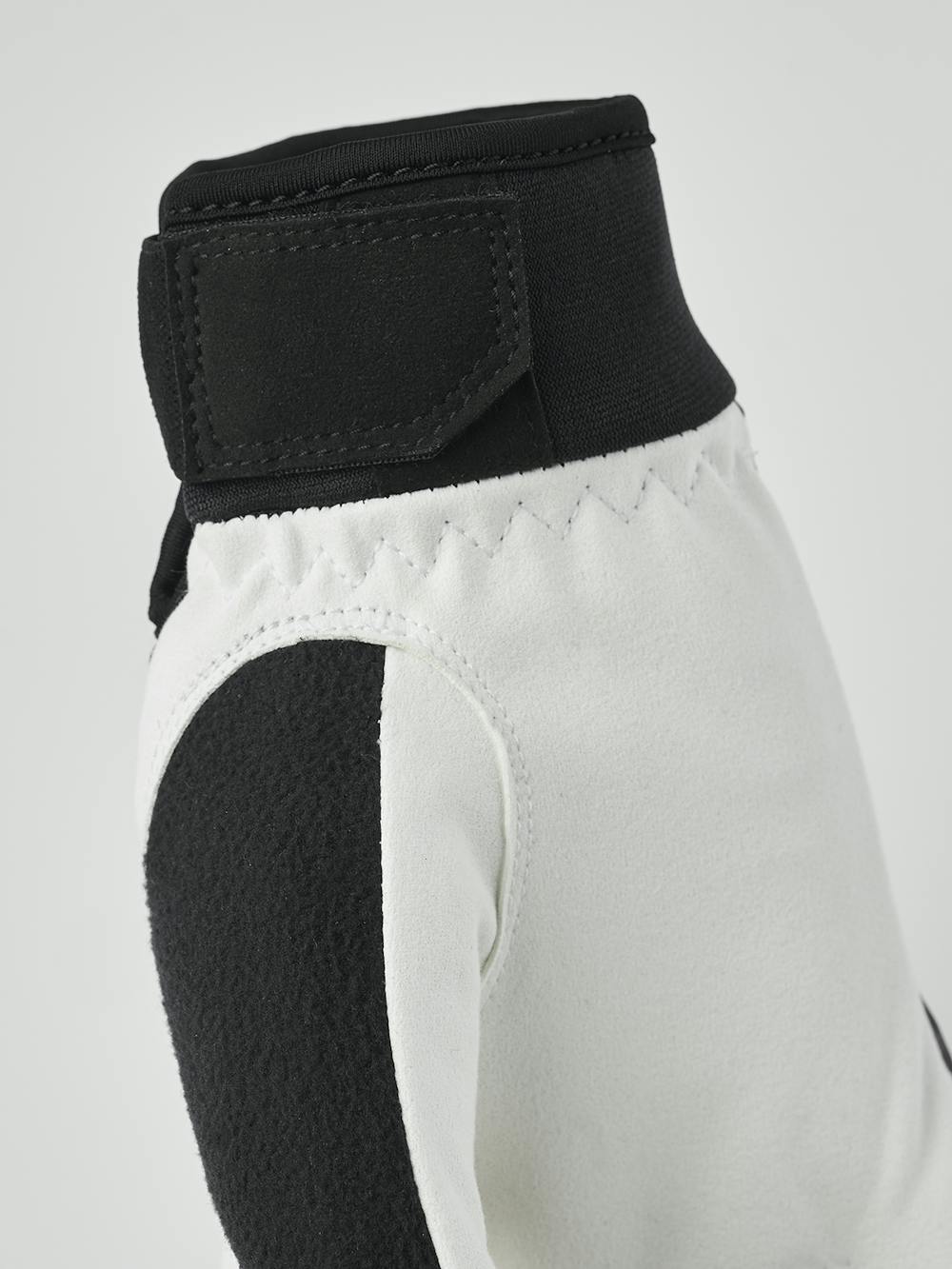 Svart och rosa längdskidhandske i tyg med vit innerhand i syntetisk mocka
(4 av 7)