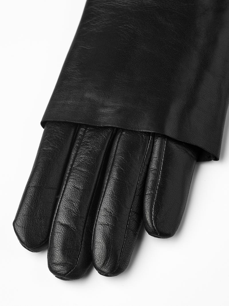 Black machine-sewn leather glove with folded ‘cape’
 (3 of 9)