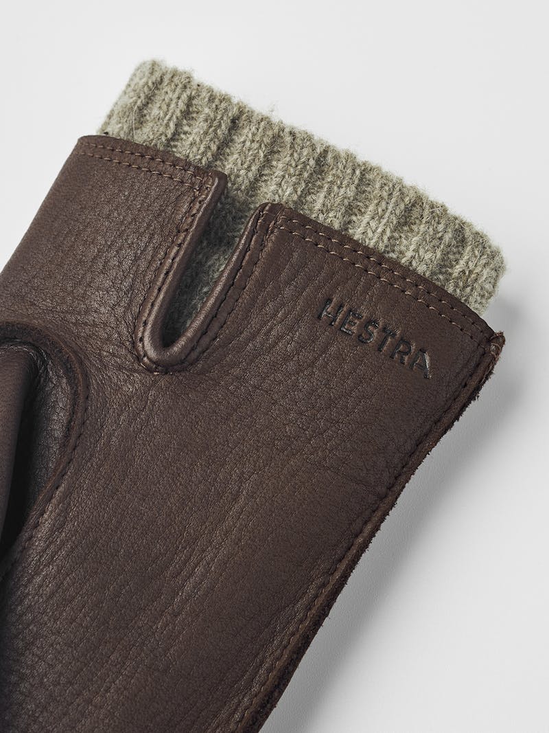 Brown machine-sewn deerskin glove with beige extended wool lining
 (4 of 5)