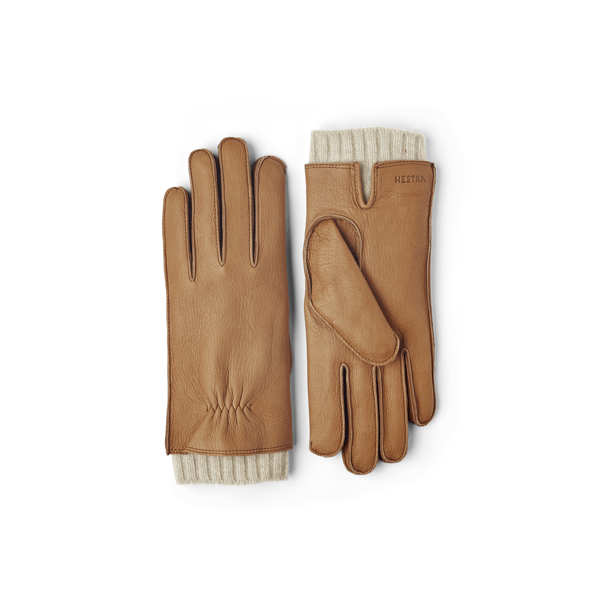 Ljusbrun maskinsydd skinnhandske i hjortskinn med ljusbeige utstickande ullfoder
(1 av 10)