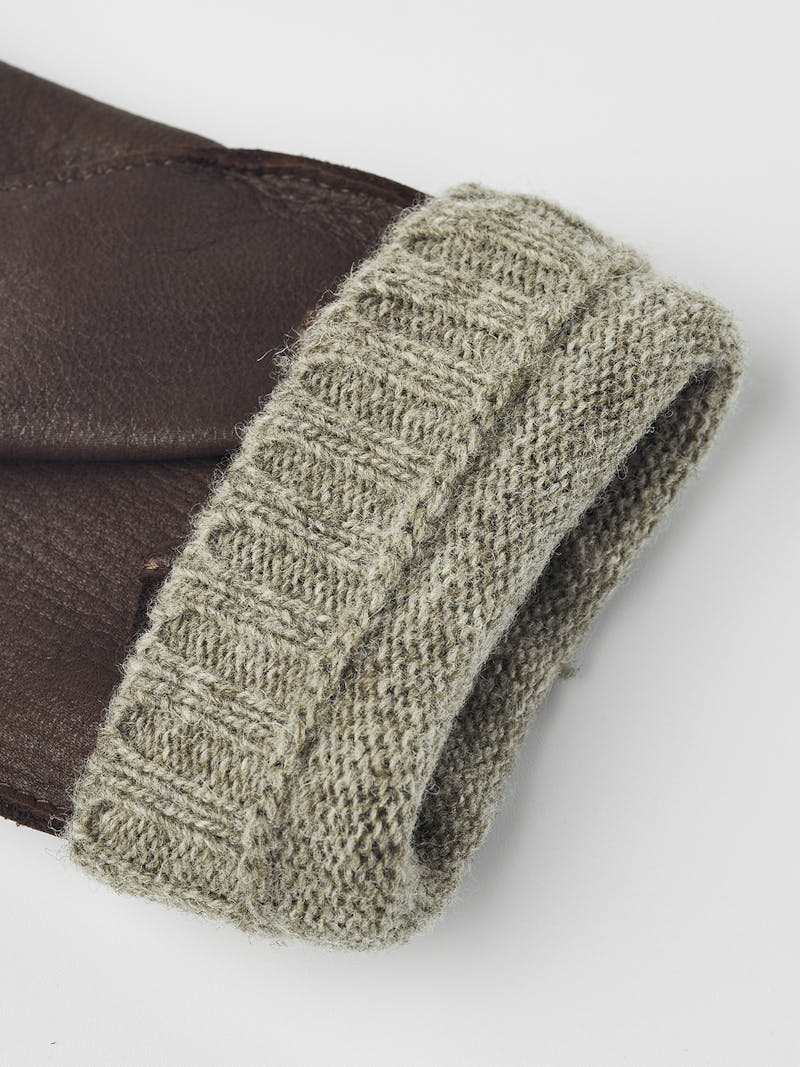 Brown machine-sewn deerskin glove with beige extended wool lining
 (2 of 5)