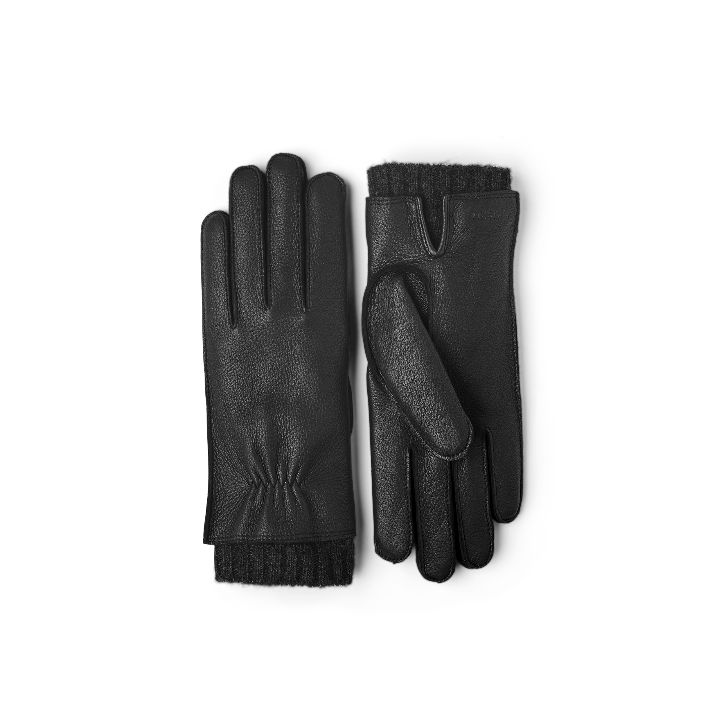 Svart maskinsydd skinnhandske i hjortskinn med utstickande ullfoder
(1 av 5)