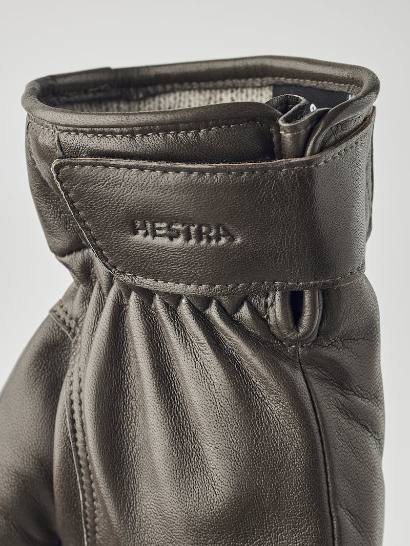 Gray machine-sewn hairsheep leather glove with leather strap
 (4 of 5)