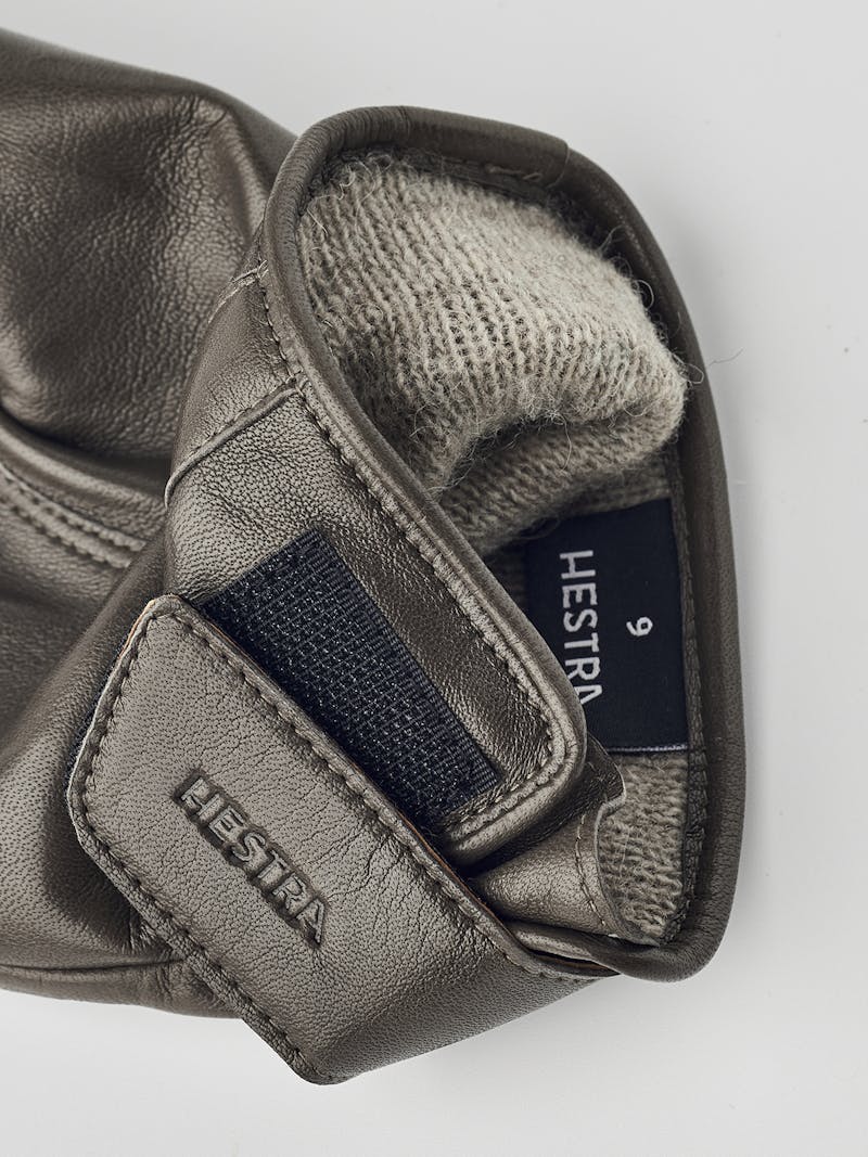 Gray machine-sewn hairsheep leather glove with leather strap
 (3 of 5)